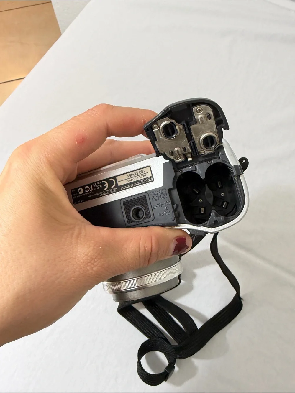 Olympus Silver Compact Digital Camera with Black Wrist Strap